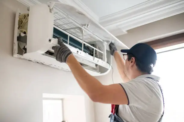 Technician inspecting a smart home appliance